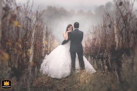   In Bergerac, Dordogne, France, the couple enjoys a portrait session, the autumn grapefruit fields providing a romantic natural backdrop.